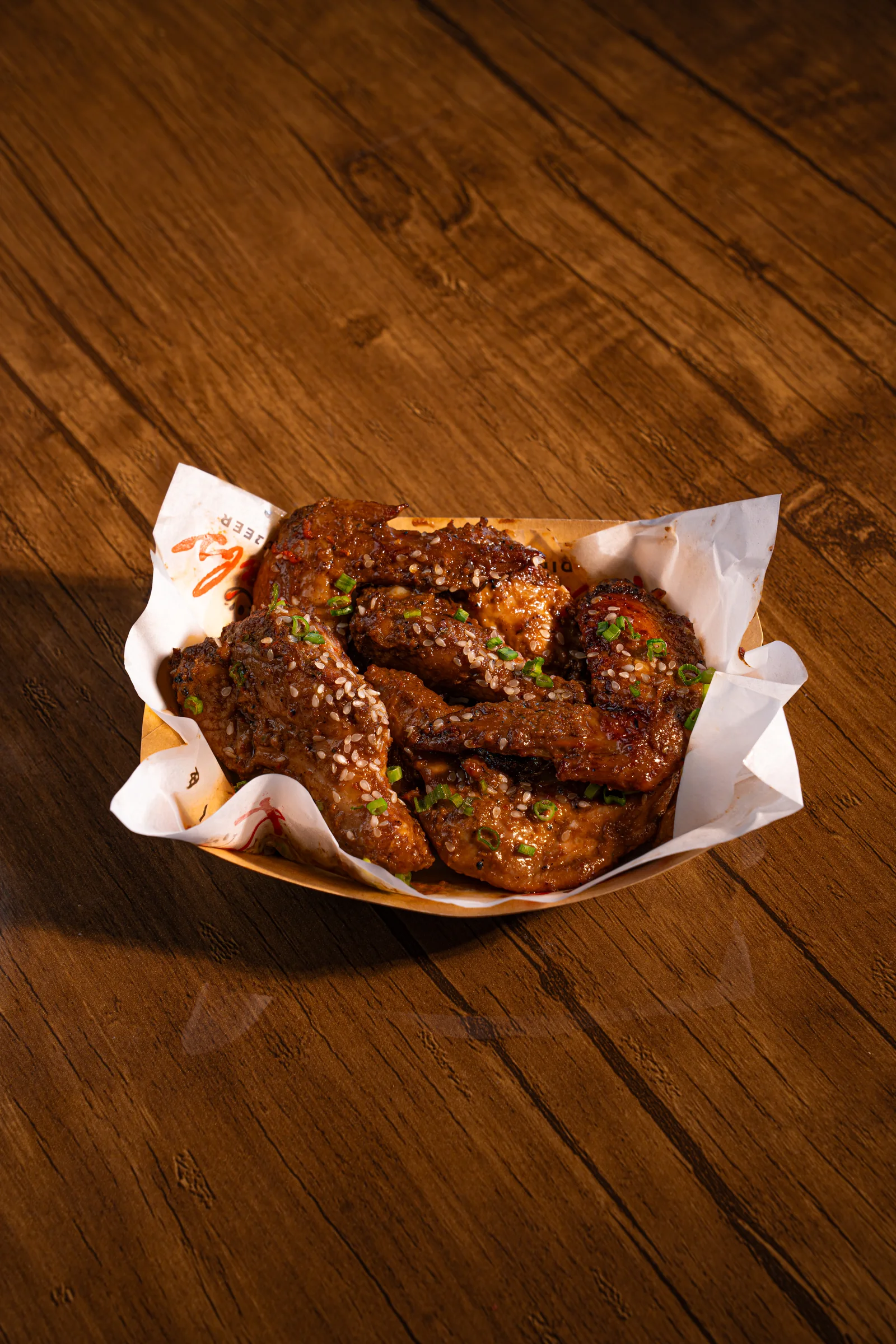 Jerk wings in a branded basket