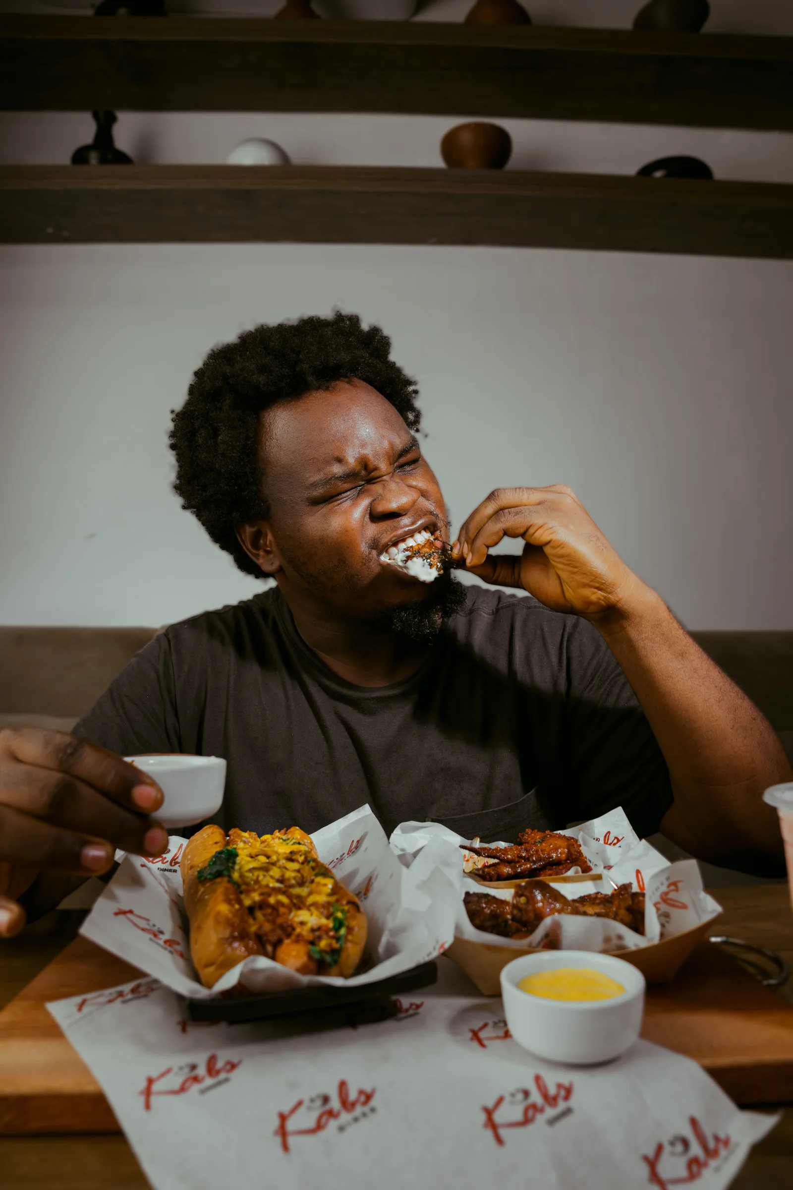 A guest digging into a Kabs spread